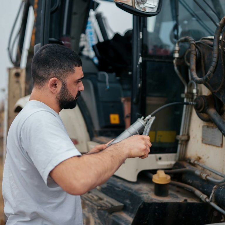 A South Jersey Lift Technician at work! A worker operating machinery, preparing equipment for use on a construction site.